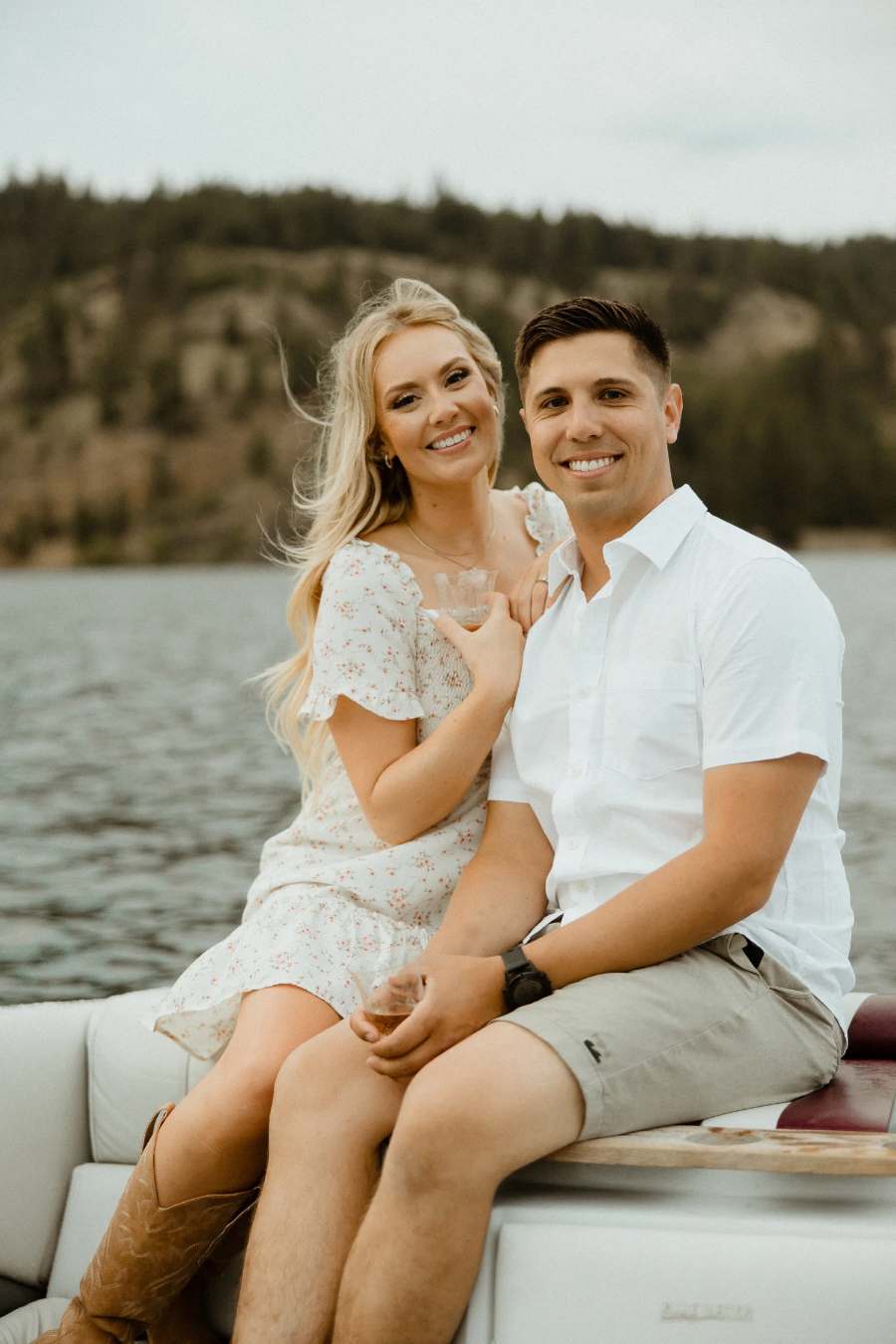 Kiana and Taylor on a boat on the lake