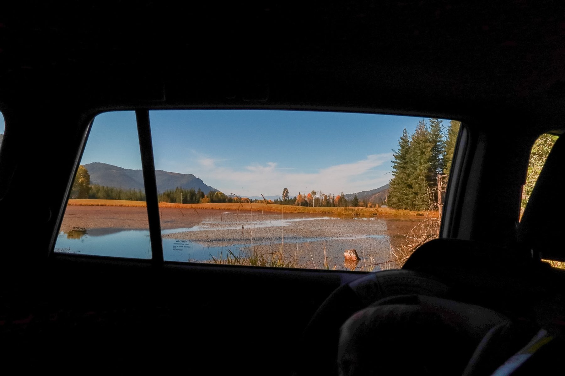 The Clark Fork valley in fall color, seen through the car window