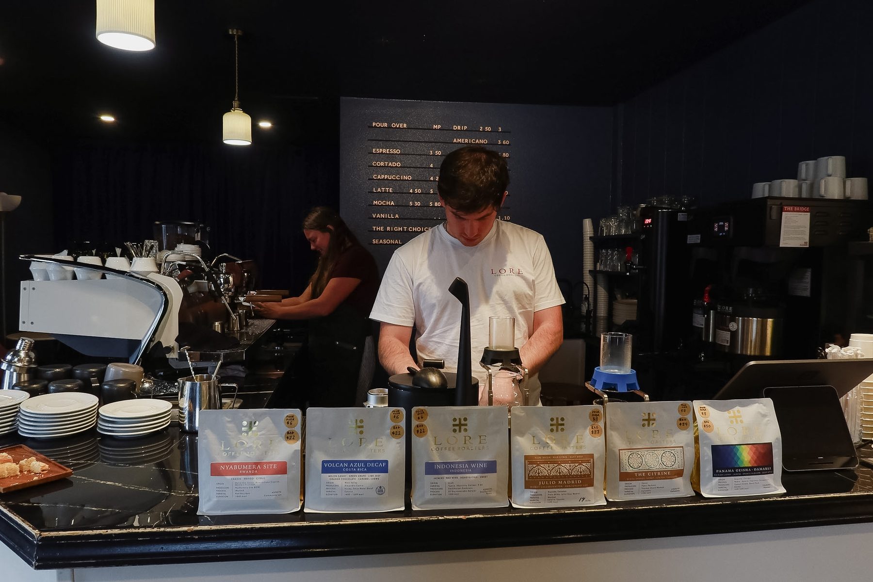The Lore Coffee bar with bags of coffee lined up on the counter