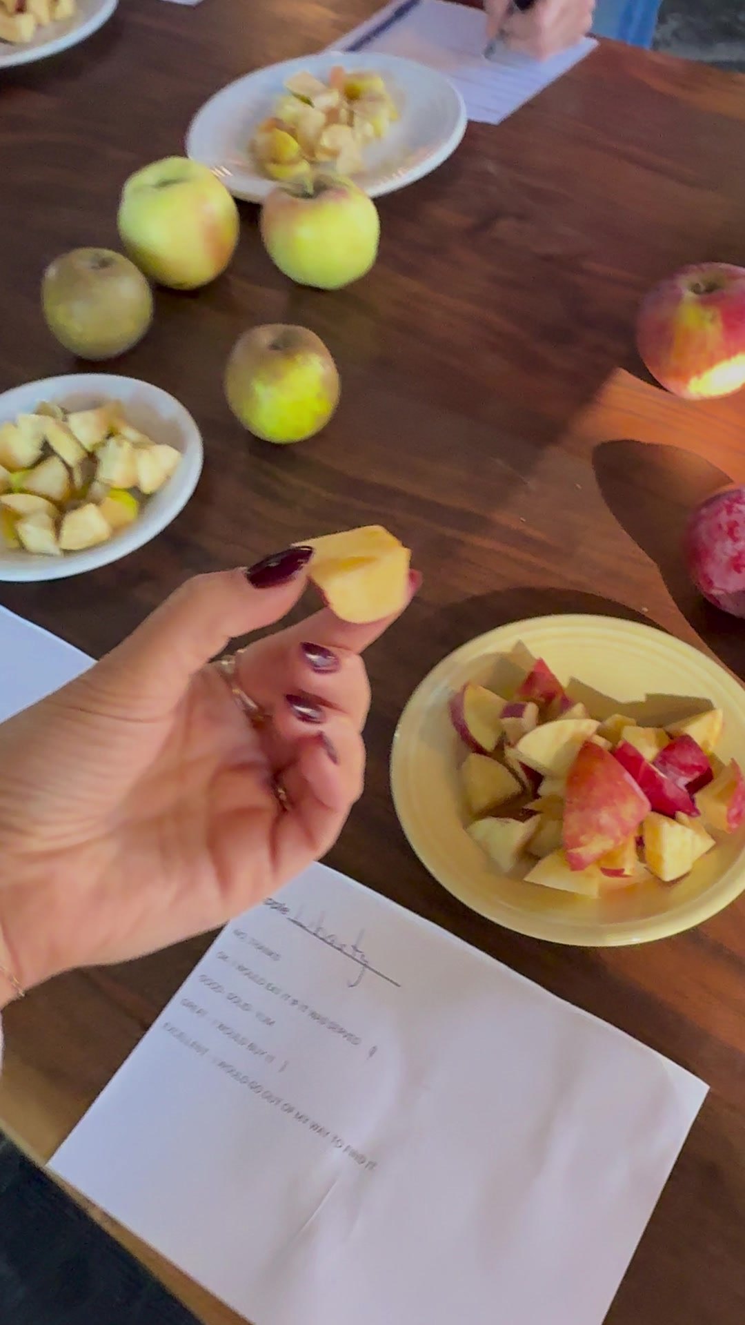 Sampling apple slices at the tasting