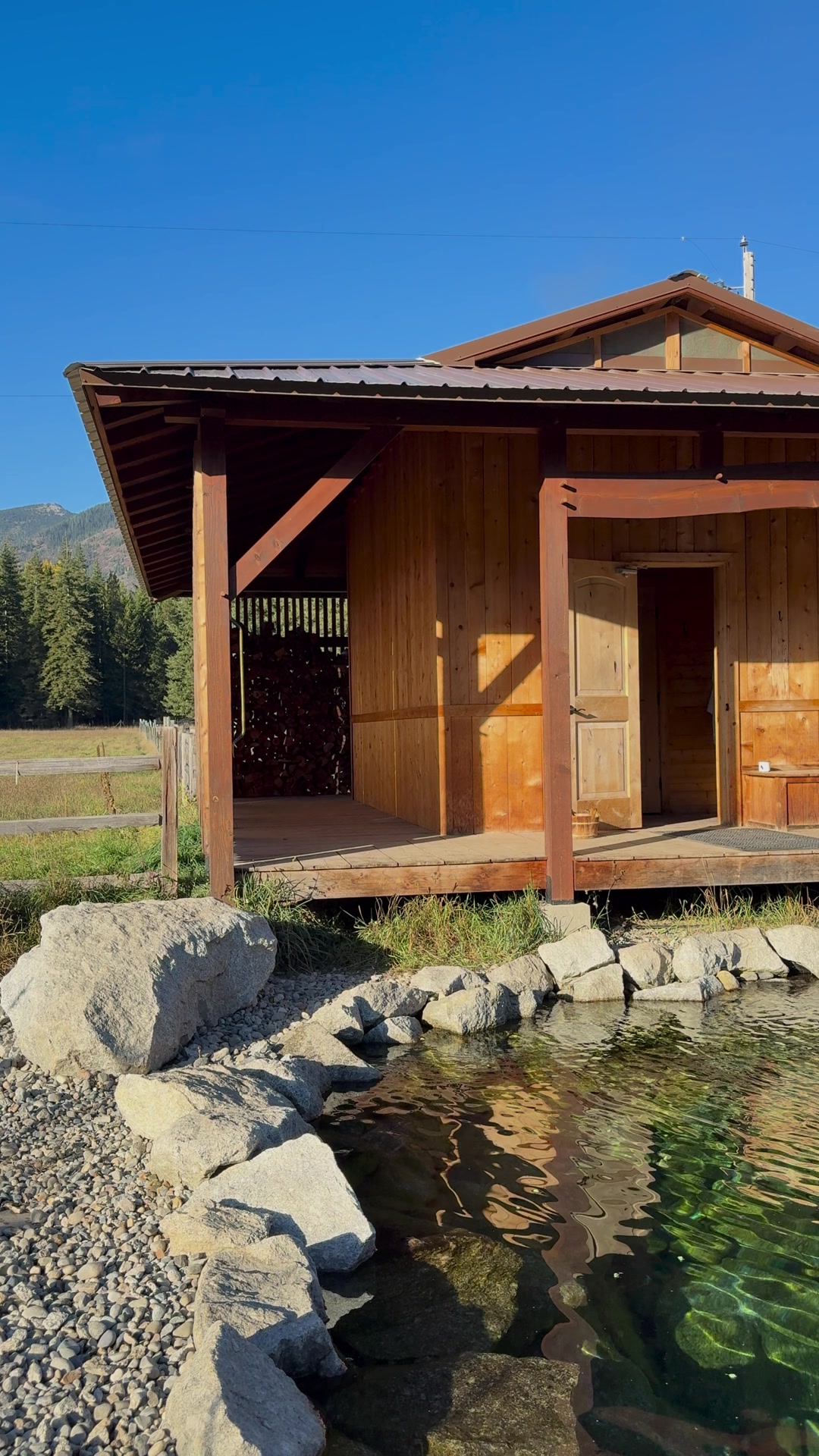 The cedar sauna house beside the cold plunge