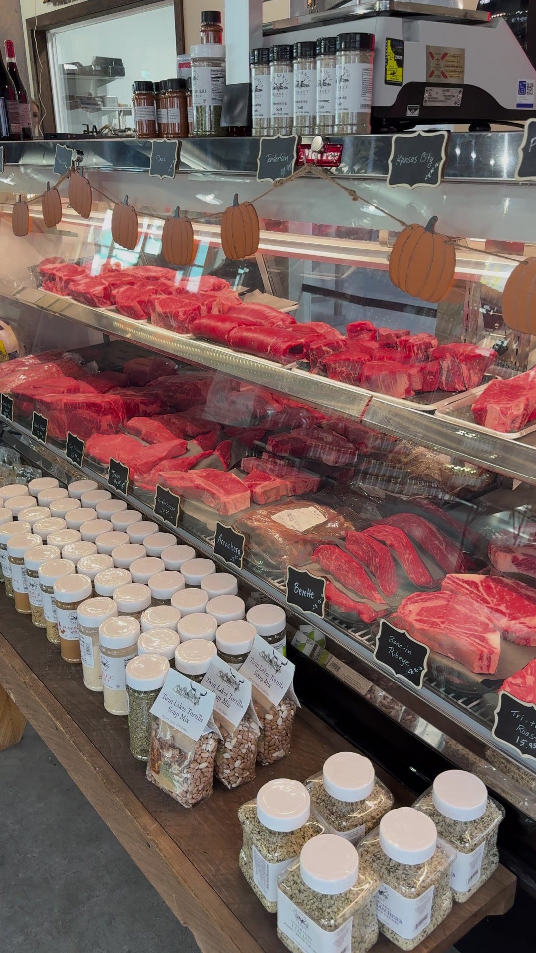 The butcher case full of fresh-cut meats