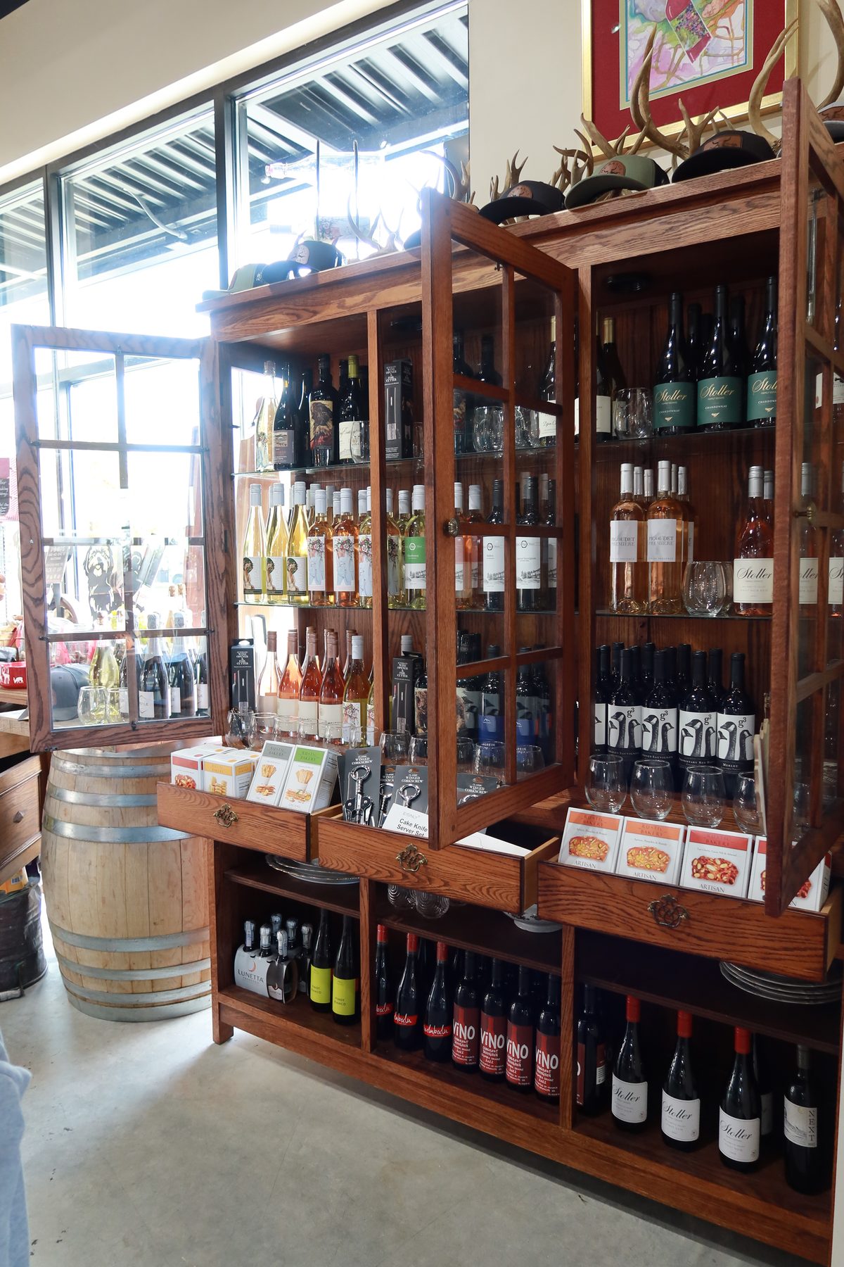 A tall wooden wine cabinet
