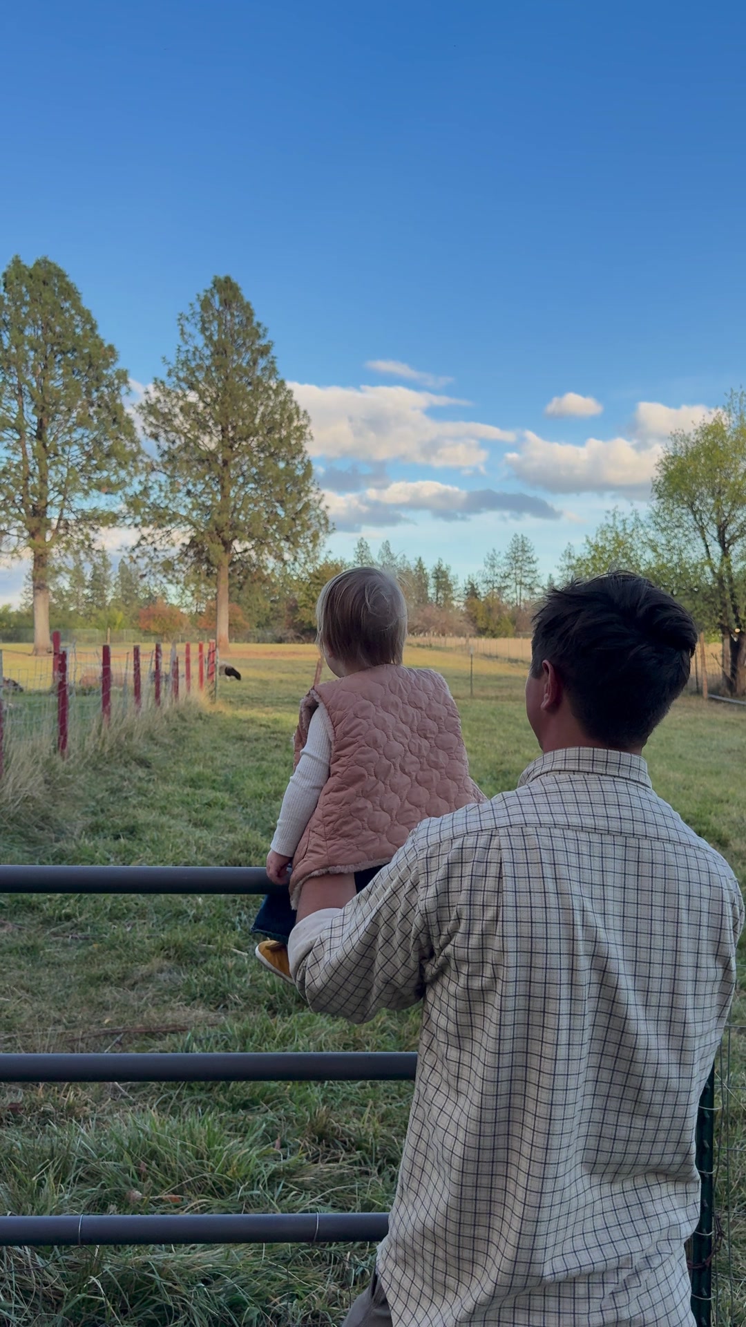 Taylor and Lona at the pasture fence