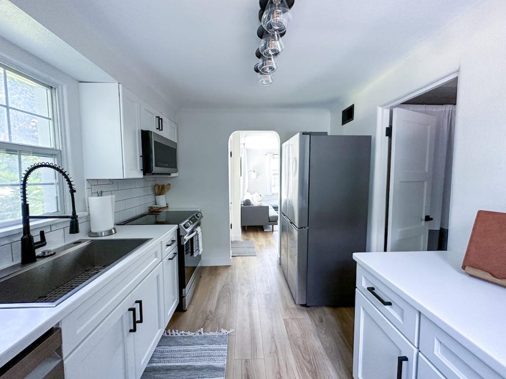 Bright white kitchen at The Captain’s Quarters