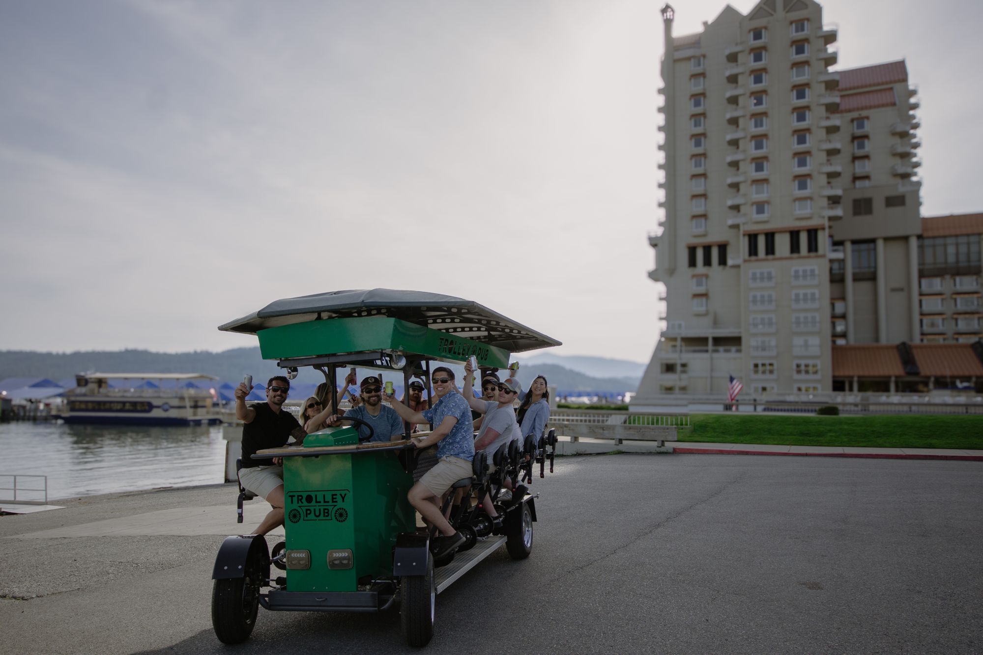 Friends riding the Trolley Pub along the lake in downtown Coeur d’Alene